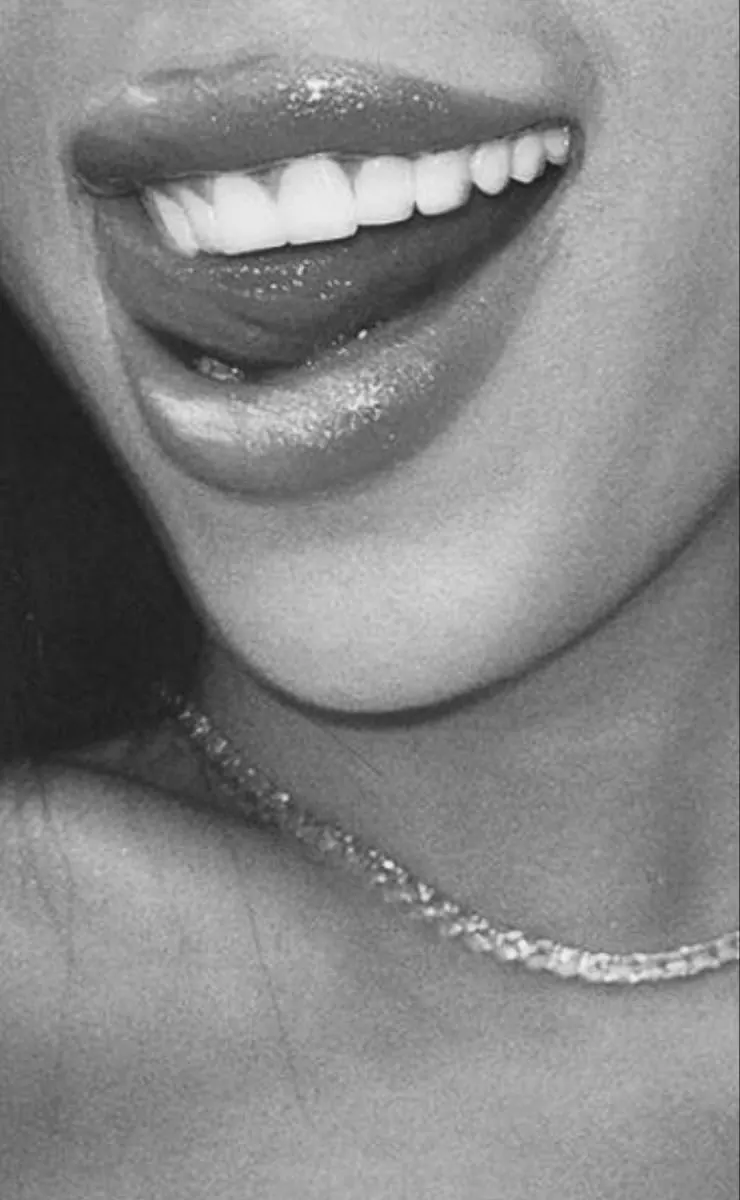Glossy lips with a delicate diamond necklace — editorial close-up
